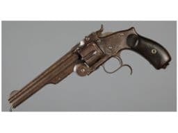 Manufactured c. 1871-1874. The barrel rib has the Smith & Wesson Cyrillic marking. Matching serial numbers on the butt, cylinder, barrel, and barrel latch. Mismatched right grip panel.